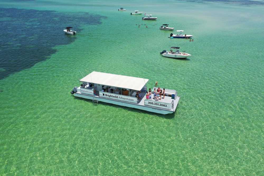 Wide aerial of the sandbar channel with the boat