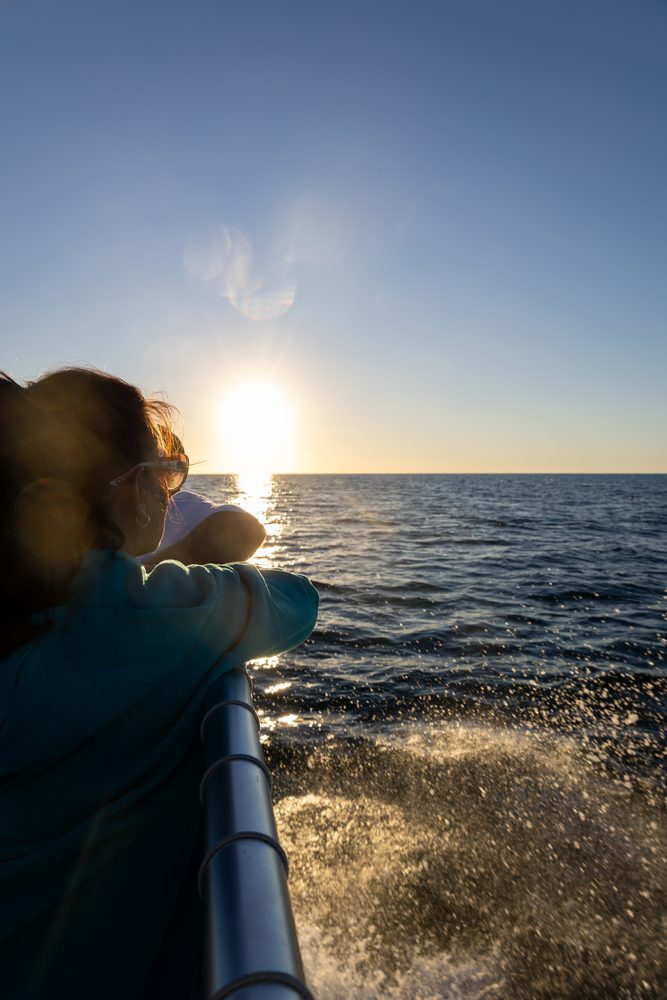 Sunset over the water from the boat