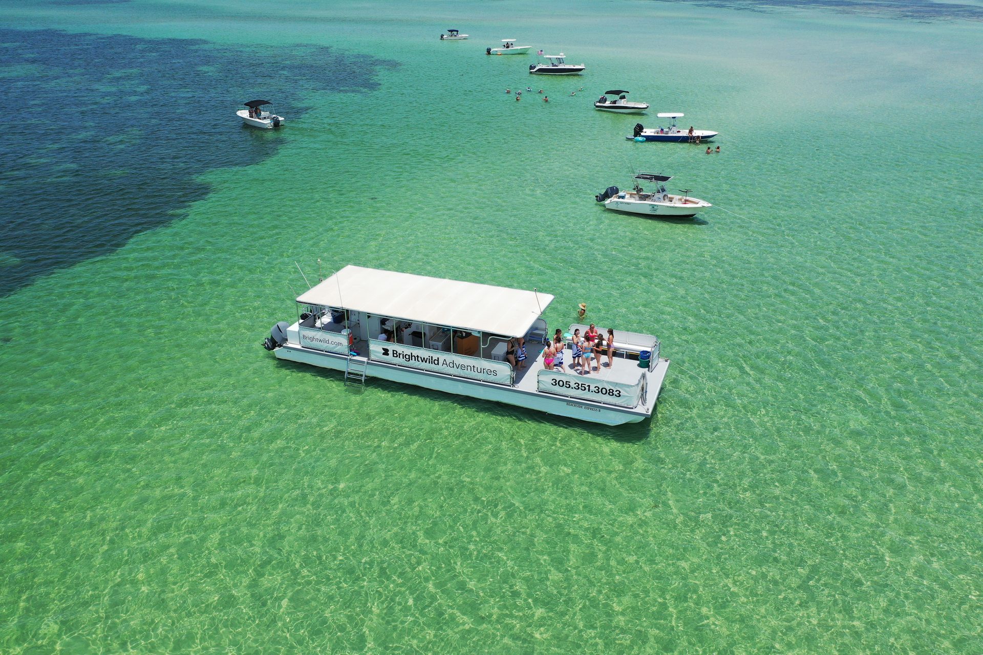 Wide aerial of the Key West sandbar with the Brightwild boat
